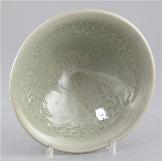 A large Chinese moulded Yaozhou celadon bowl, Jin dynasty (1115-1234), diameter 20.2cm
